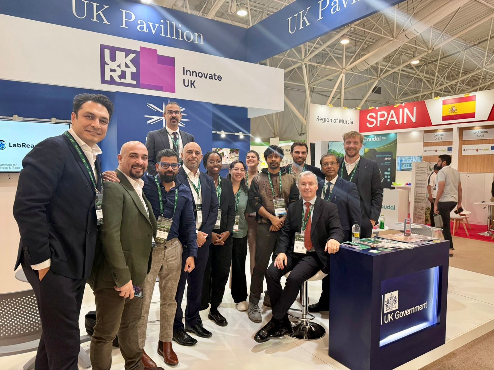A group of delegates at the UK Pavilion and Innovate UK stand at an international trade show
